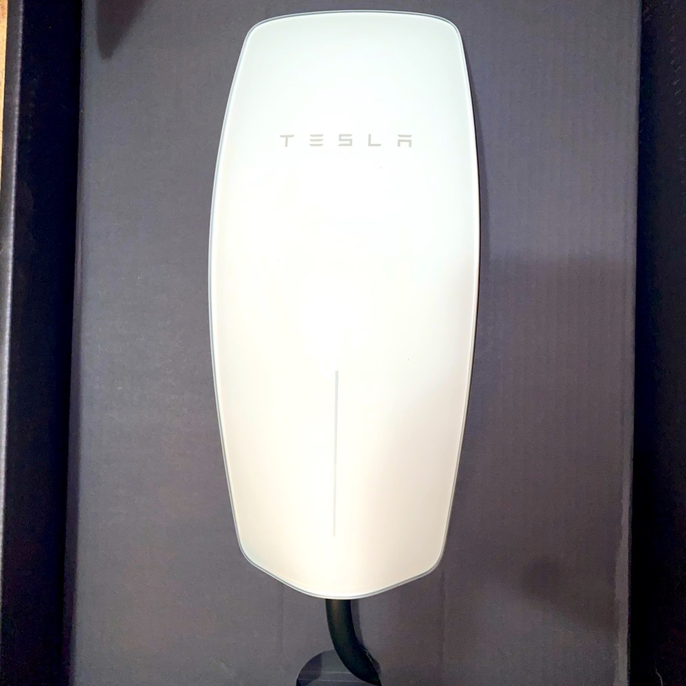 Brand new Never been used! Tesla wall connector charger in the color white.